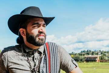 Obraz premium Latin man with cowboy hat enjoying his vacation in Colombia. Culture, travel and holidays.