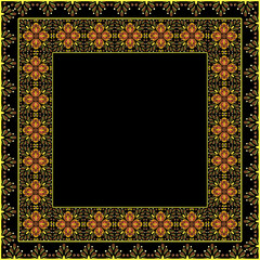 A piece of fabric with an intricate floral pattern in yellow and gold on a black background, forming a complex rectangular design