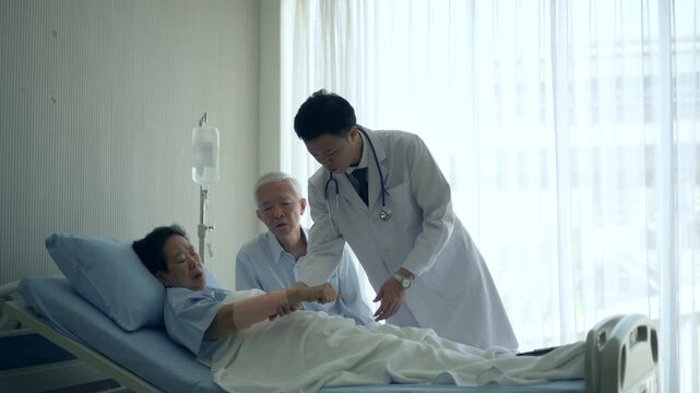 doctor come round checking Asian senior admit in hospital accident hurt husband worry