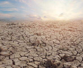 Cracked brown soil, barren wasteland surface natural background