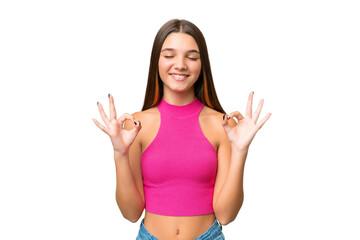 Fototapeta premium Teenager caucasian girl over isolated background in zen pose