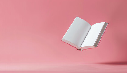 Floating open book against a soft pink background, showcasing the concept of imagination and creativity. The book appears weightless, emphasizing a dreamy atmosphere.
