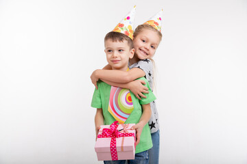 kids celebrating birthday party with paper emotions happy and smiley on white background, siblings relationship 