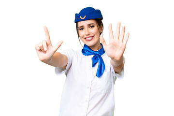 Airplane stewardess over isolated chroma key background counting seven with fingers