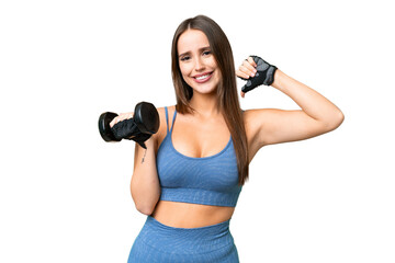 Young sport woman making weightlifting over isolated chroma key background proud and self-satisfied