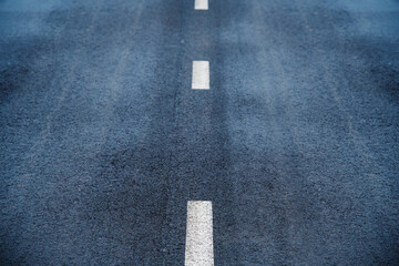 Asphalt highway with road markings lines