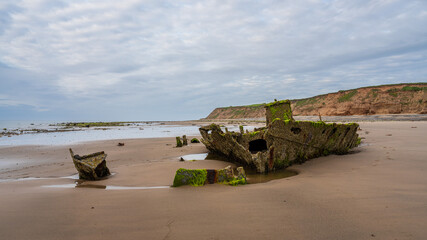 Stones on the beach and the ST Pasages Shipwreck between Ballasalla and Sartfield, Isle of Man