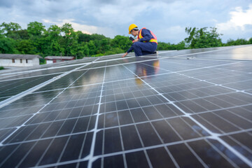 An electrical engineer installs solar panels in a power plant Engineers examine solar panels Renewable energy technology and sustainability Alternative energy for the future.