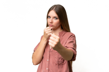 Young beautiful blonde woman over isolated background with fighting gesture