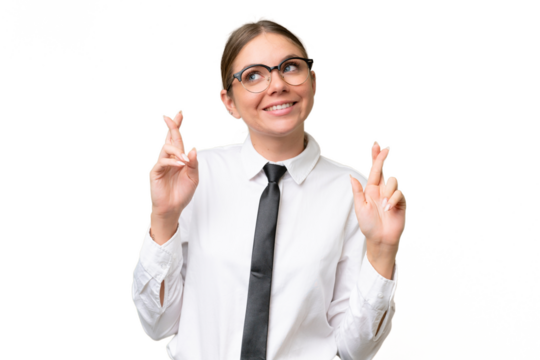 Young business caucasian woman over isolated background with fingers crossing