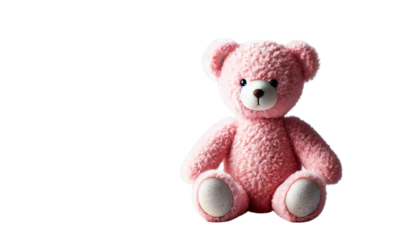 A plush teddy bear in soft pink, sitting upright. The bear has a round face, small black eyes, and a fluffy texture, on a transparent background