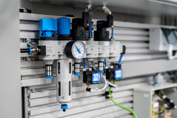 Compressed air preparation unit with pressure gauge 6 bars and two digital gauges mounted on the wall of technology