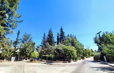 Street photography of Psychiko, an upscale residential district just north of the Athens center with plenty of quiet, leafy, tree-lined streets, great for walks.