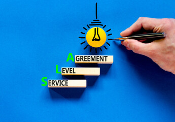 SLA service level agreement symbol. Concept words SLA service level agreement on beautiful wooden...