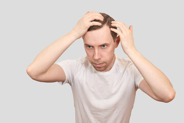 Fototapeta premium Man baldness treatment. Anti hairloss clinic test. Nature hair care procedure. Diagnostic scalp. Male person checking dermatology skin. Home routine. Trichologist cosmetic