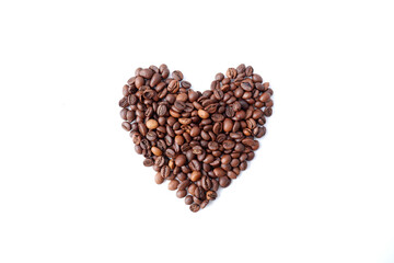 Coffee beans on a white background in the shape of a heart.