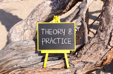 Theory and practice symbol. Concept words Theory and practice on beautiful black yellow blackboard....