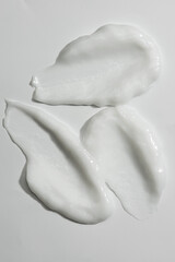 smears of cream on a white background