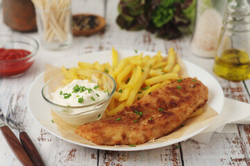 Fish and chips served on the plate, traditional dish of Great Britain