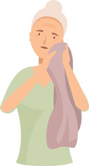 Senior woman wiping her face with a towel after taking a shower