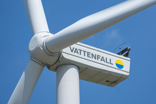 Middenmeer, Netherlands - June 6, 2024: Vattenfall wind turbine against blue sky