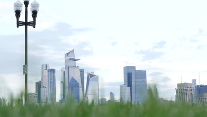 New York City waterfront skyline, Manhattan Midtown Hudson Yards buildings, riverfront skyscrapers. Waterside cityscape from Pier A Park, Hoboken, New Jersey. United States architecture, grass lawn.