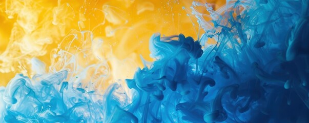 Blue and yellow ink clouds in water, abstract background