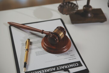 Law theme, gavel or mallet of the judge, lawyer enforcement officers, evidence-based cases taken into account in the court abount business, legislation.