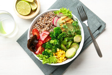 Healthy meal. Tasty products in bowl on white table, top view