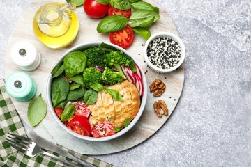 Healthy meal. Delicious chicken, vegetables and spinach served on table, flat lay. Space for text