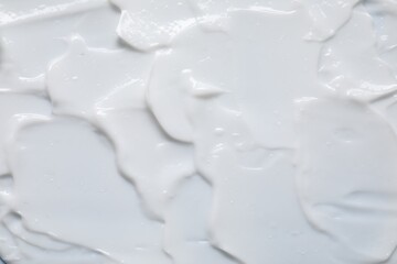Texture of face cream as background, top view