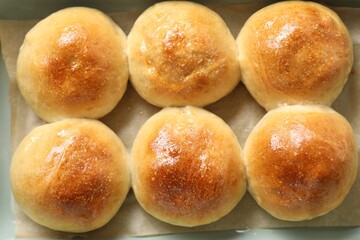 Delicious dough balls in baking dish, top view