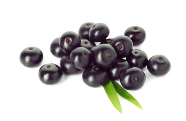 Fresh ripe acai berries and green leaves isolated on white