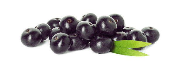 Fresh ripe acai berries and green leaves isolated on white