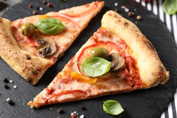 Cut delicious vegetarian pizza and spices on table