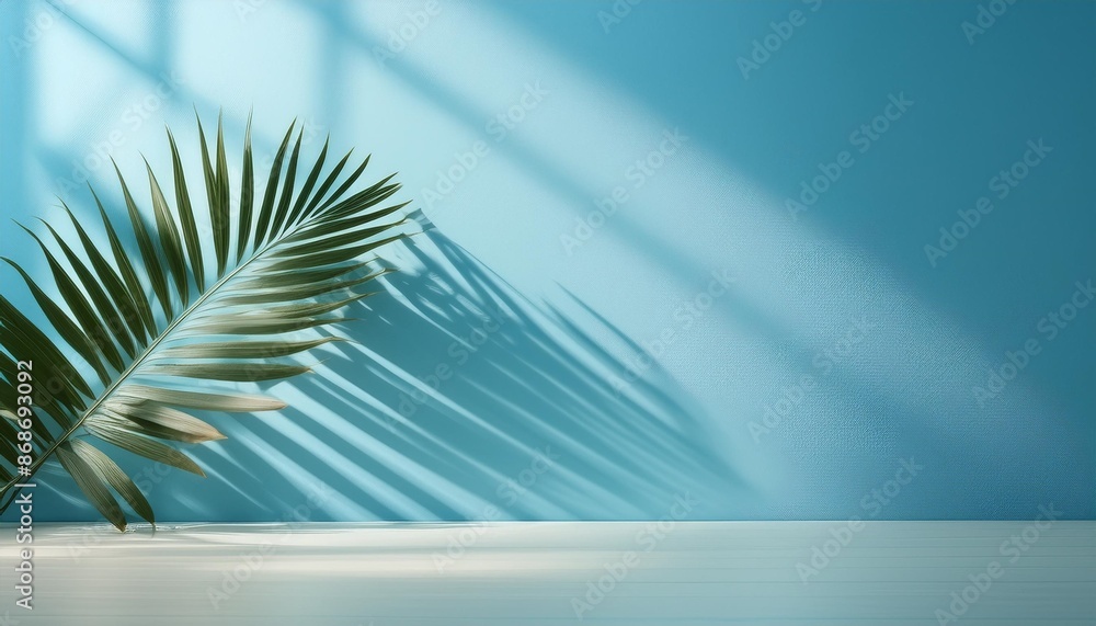 Canvas Prints blurred shadow from palm leaves on the light blue wall minimal abstract background for product prese