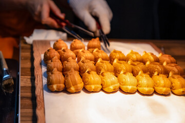 Shapes made of pastry dough on baking paper