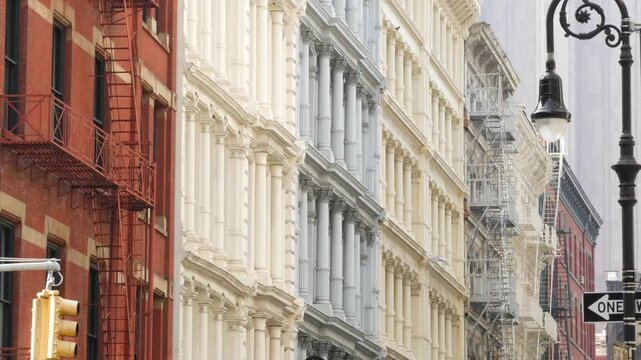 New York City Manhattan Soho fashion district near Broadway street. USA urban building facade, old classic american architecture. Shopping in NYC, United States. Business and residential real estate.