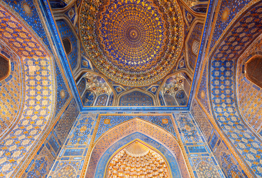 Samarqand, Uzbekistan - April - 04 - 2024: Interior with gold and blue colors of the Tillya-Kori Madrasah in the centre of Samarqand in Uzbekistan.