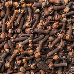 Obraz premium Dry spice cloves texture background, scattered seasoning pattern, dry carnation condiment mockup