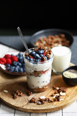 Overnight oat with berries and white yogurt in a glass