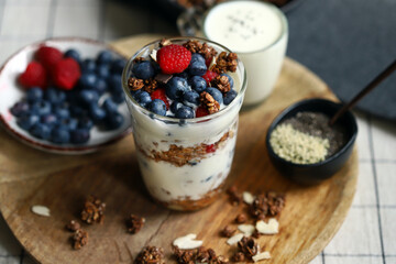 Overnight oat with berries and white yogurt in a glass