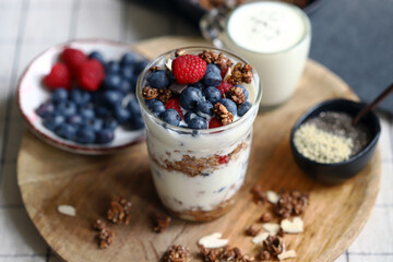Overnight oat with berries and white yogurt in a glass
