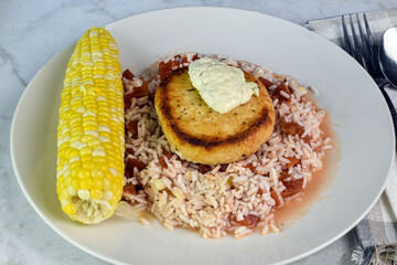 salmon burger on rice with tomatoes