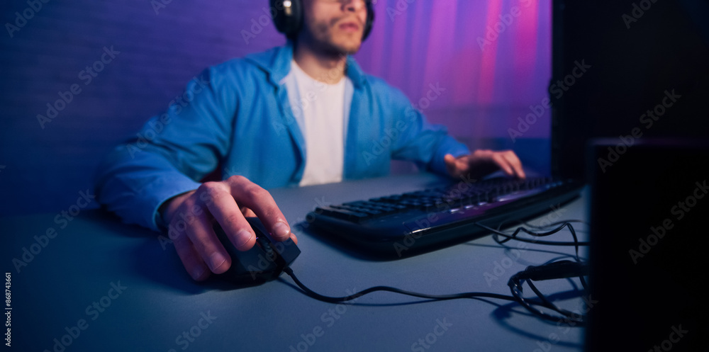 Poster a mans hand rests on a computer mouse, with the keyboard in the background. the man is wearing a blu