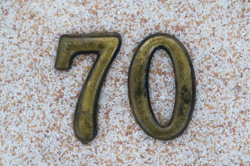 House number seventy. Yellow number seventy