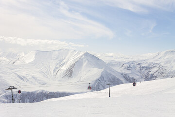 The peaks of snowy Caucasus mountains in The Gudauri Ski Resort, Georgia. Snowboarding in The Gudauri Ski Resort, Georgia