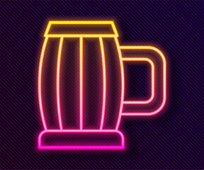 Glowing neon line Wooden beer mug icon isolated on black background. Vector