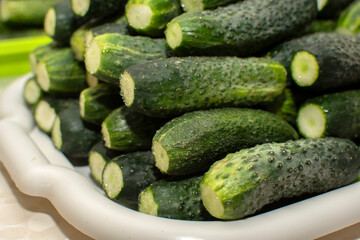 Closeup view of a pile of cucumbers	