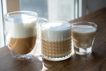 glass of coffee milk on wooden table